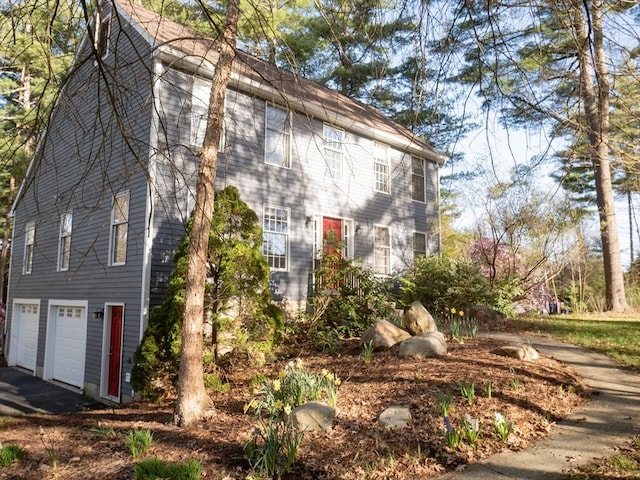 view of side of home featuring a garage