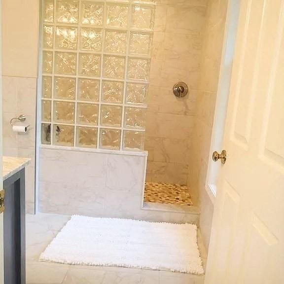 full bath featuring walk in shower