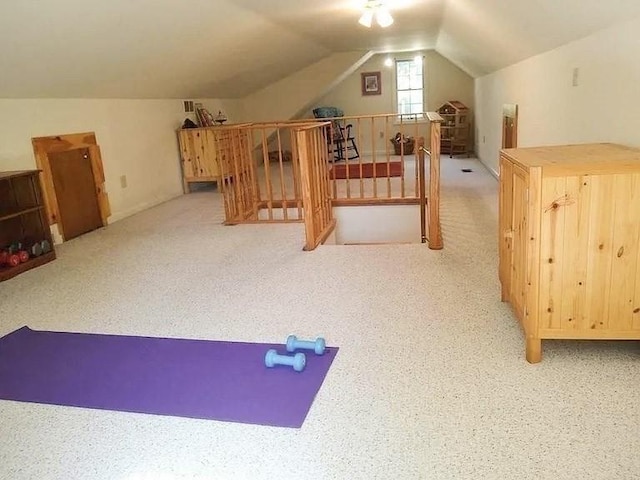 additional living space with lofted ceiling and carpet floors