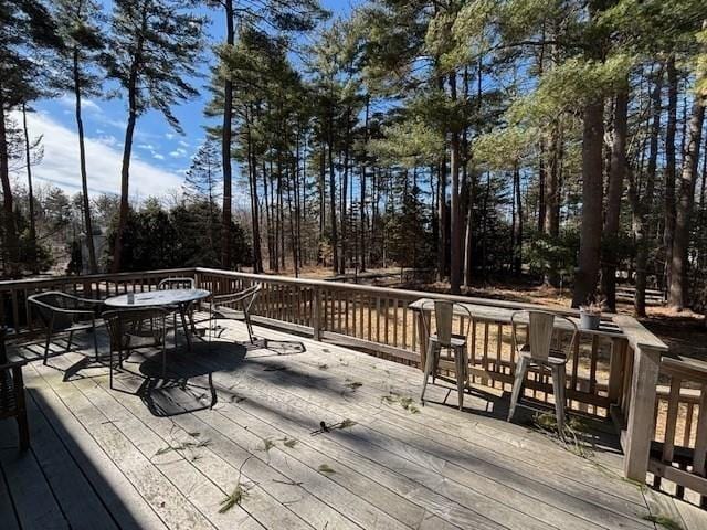 wooden deck with outdoor dining space