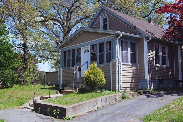 27 Bushwick Pl, Springfield, MA 01109 - bungalow-style home featuring entry steps, a chimney, and roof with shingles