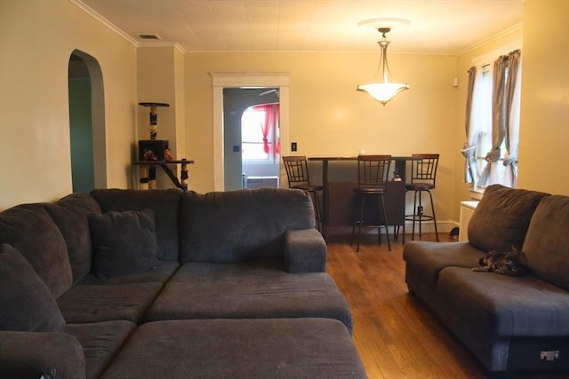 27 Bushwick Pl, Springfield, MA 01109 - living room featuring wood finished floors, crown molding, and arched walkways