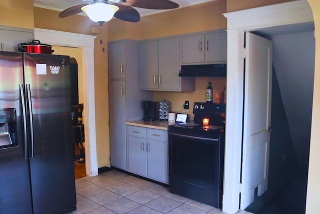 27 Bushwick Pl, Springfield, MA 01109 - kitchen featuring stainless steel fridge with ice dispenser, black / electric stove, under cabinet range hood, a ceiling fan, and light tile patterned floors