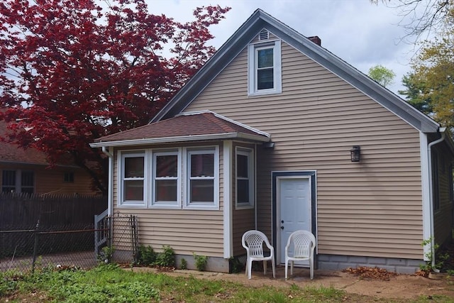 27 Bushwick Pl, Springfield, MA 01109 - back of house with a chimney