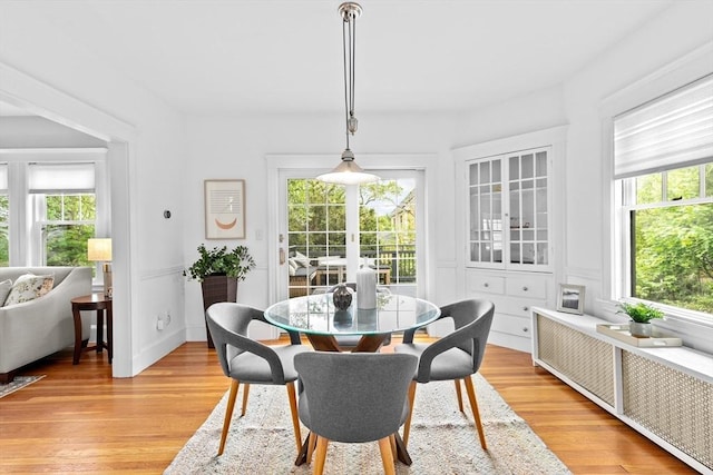 dining room with light wood-style flooring