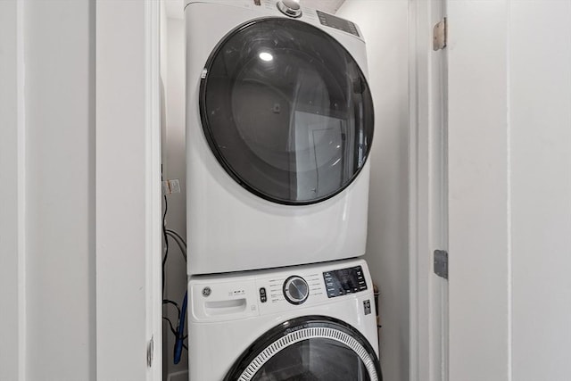 laundry room featuring laundry area and stacked washing maching and dryer