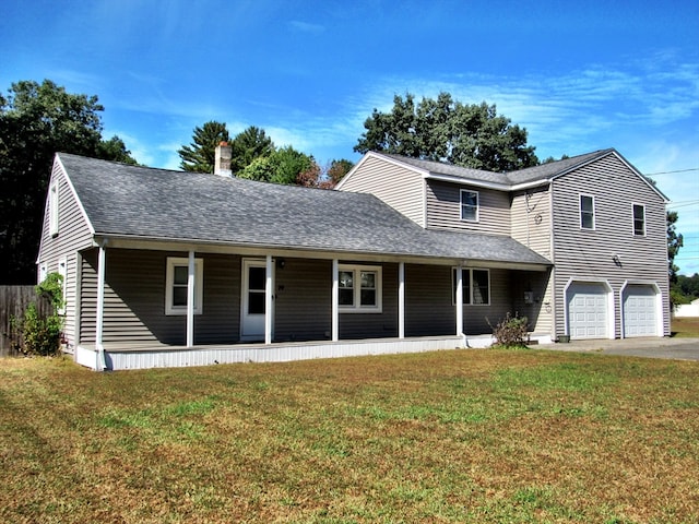 front facade with a garage and a front yard