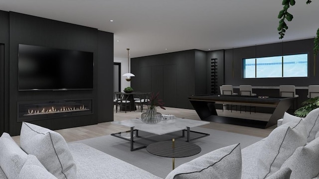 living room featuring a fireplace, track lighting, and light wood-type flooring