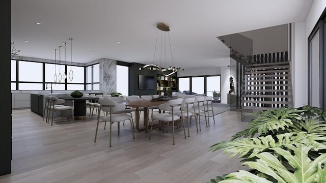 dining space featuring light hardwood / wood-style flooring and a notable chandelier