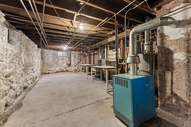 253 Sycamore St Unit 1, Watertown, MA 02472 - unfinished basement featuring a heating unit