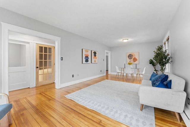 253 Sycamore St Unit 1, Watertown, MA 02472 - living area with light wood-style floors and baseboards