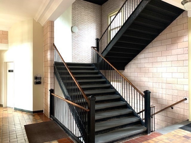 stairway with a towering ceiling