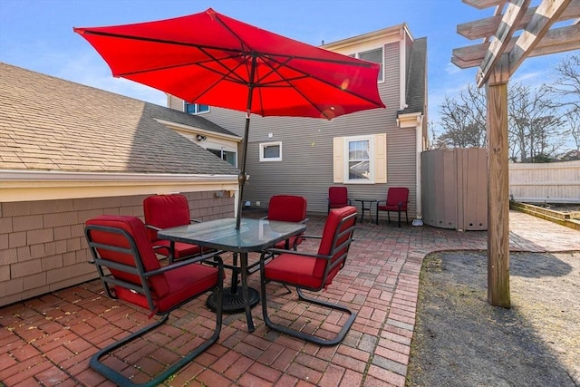 view of patio / terrace featuring fence and outdoor dining area