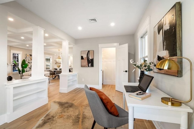 home office featuring decorative columns, light hardwood / wood-style flooring, beam ceiling, and coffered ceiling