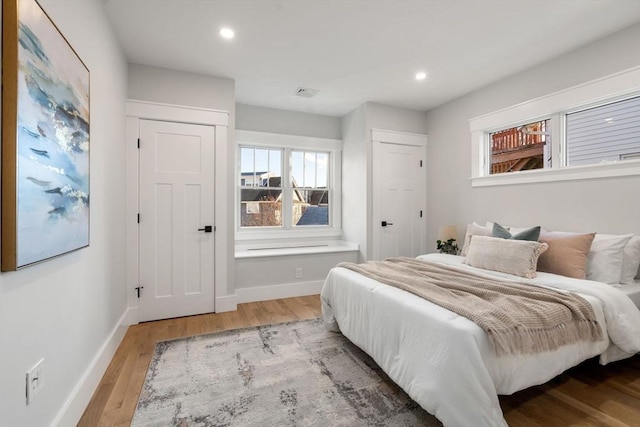 bedroom with light hardwood / wood-style floors