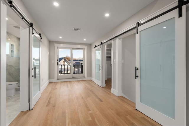 corridor featuring light hardwood / wood-style flooring