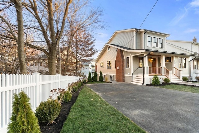 view of property exterior with covered porch