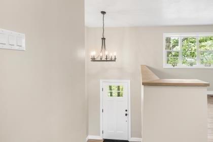 537 S River St, Marshfield, MA 02050 - entrance foyer featuring healthy amount of natural light, a chandelier, and baseboards