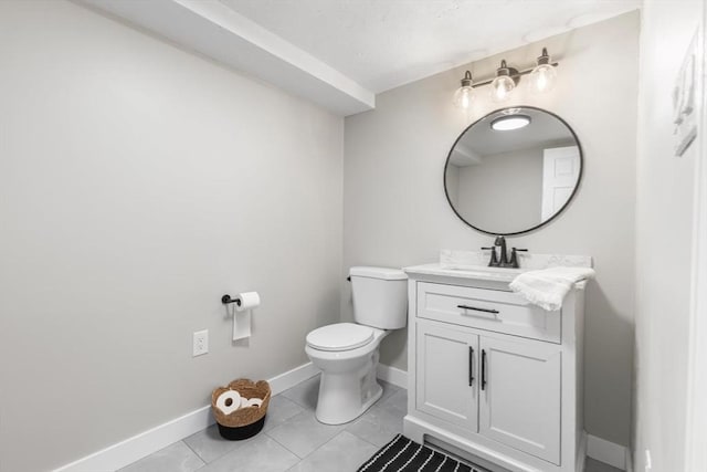 537 S River St, Marshfield, MA 02050 - half bath featuring vanity, toilet, baseboards, and tile patterned flooring