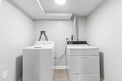 537 S River St, Marshfield, MA 02050 - laundry area with separate washer and dryer and baseboards