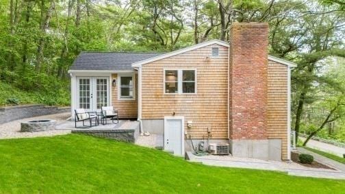 537 S River St, Marshfield, MA 02050 - rear view of property with french doors, a chimney, a patio, and a yard