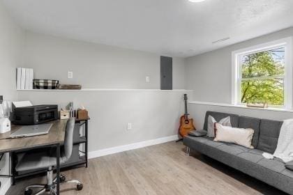 537 S River St, Marshfield, MA 02050 - office area featuring wood finished floors, electric panel, and baseboards