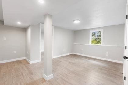 537 S River St, Marshfield, MA 02050 - basement featuring light wood-style flooring, baseboards, and recessed lighting