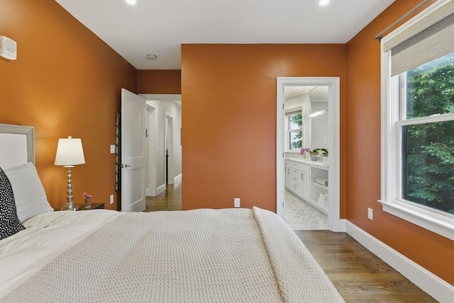 1650 Columbia Rd Unit 3, Boston, MA 02127 - bedroom featuring multiple windows, wood finished floors, and recessed lighting