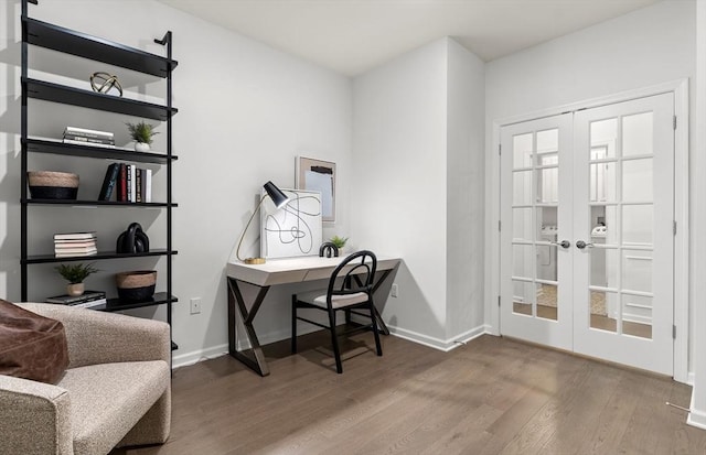 office area with french doors, wood finished floors, and baseboards