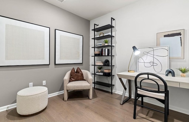office space featuring wood finished floors and baseboards