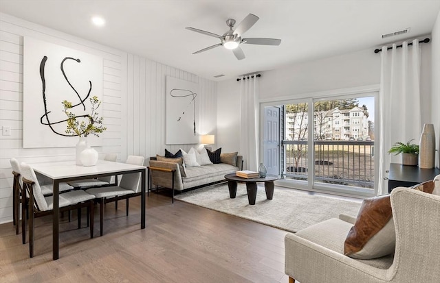 living room featuring wood finished floors and ceiling fan