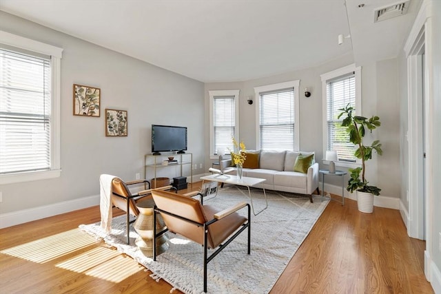 living room featuring wood finished floors and baseboards