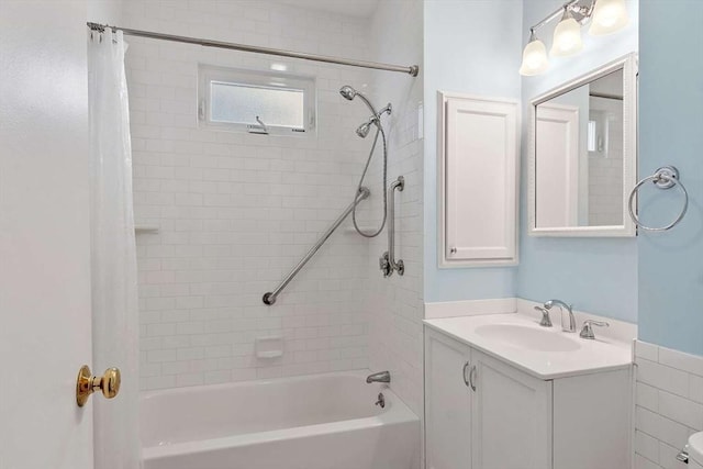 bathroom featuring shower / bathtub combination with curtain and vanity