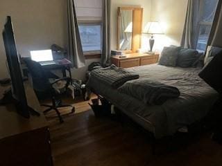 bedroom featuring dark hardwood / wood-style flooring