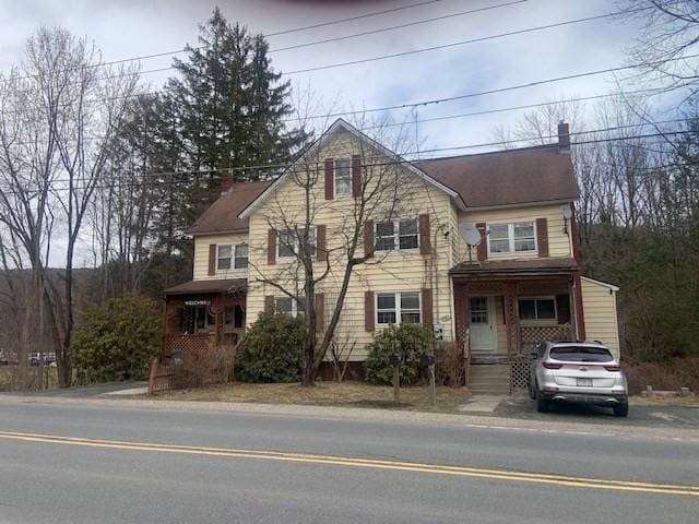 45-47 Middlefield Rd, Chester, MA 01011 - traditional-style home with a chimney