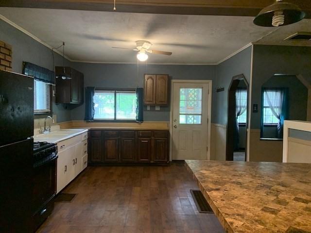 45-47 Middlefield Rd, Chester, MA 01011 - kitchen with a sink, black appliances, ceiling fan, crown molding, and dark wood-style flooring