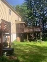 45-47 Middlefield Rd, Chester, MA 01011 - back of house with a wooden deck and a yard