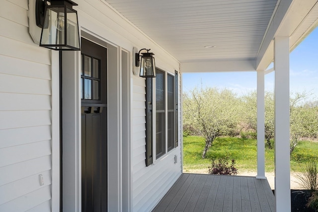 wooden deck featuring covered porch