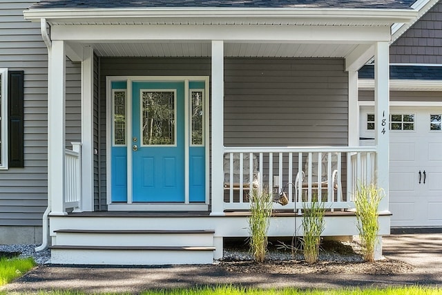 doorway to property featuring covered porch