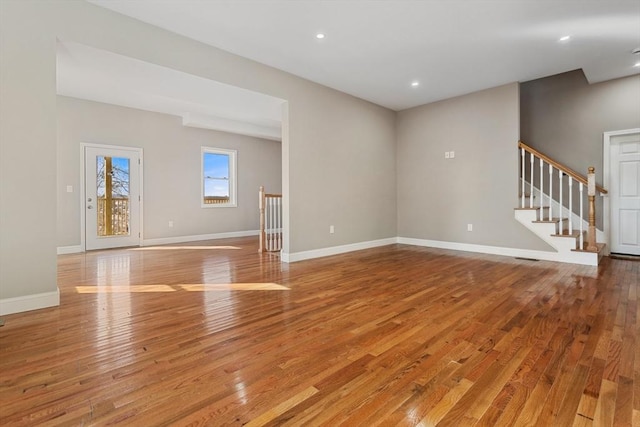 unfurnished living room featuring light wood-type flooring