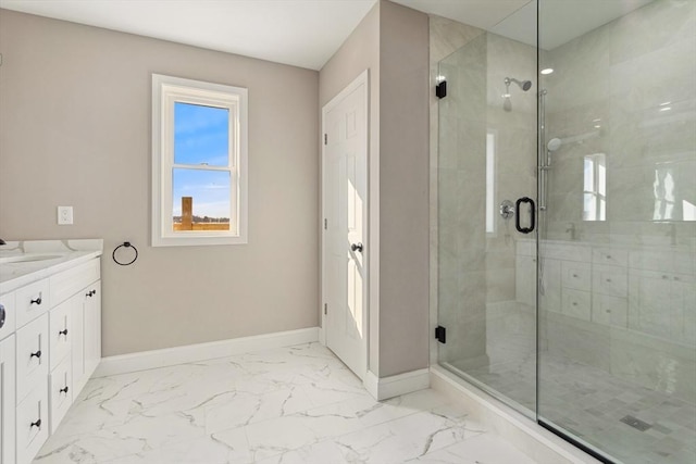 bathroom featuring vanity and a shower with shower door