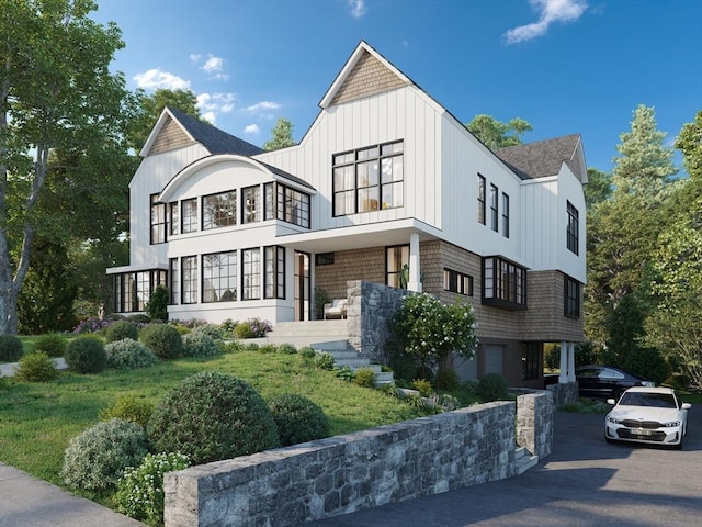view of property exterior with a shingled roof and board and batten siding