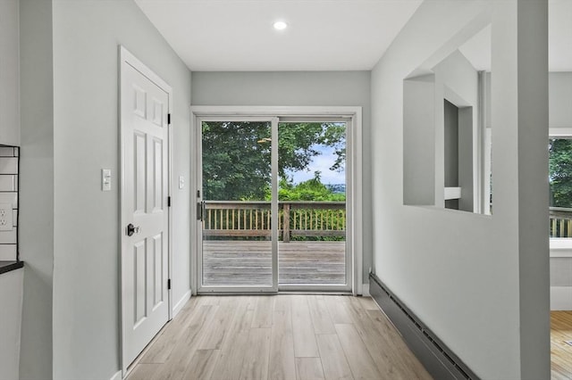 112 Brookline St, Worcester, MA 01603 - entryway featuring a baseboard heating unit, wood finished floors, and recessed lighting