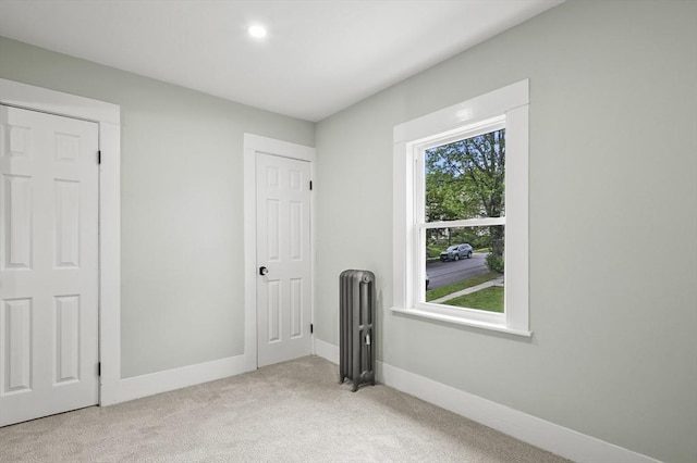 112 Brookline St, Worcester, MA 01603 - unfurnished bedroom featuring radiator, light colored carpet, and recessed lighting