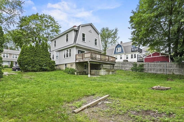 112 Brookline St, Worcester, MA 01603 - rear view of house with a deck, a gambrel roof, and a chimney