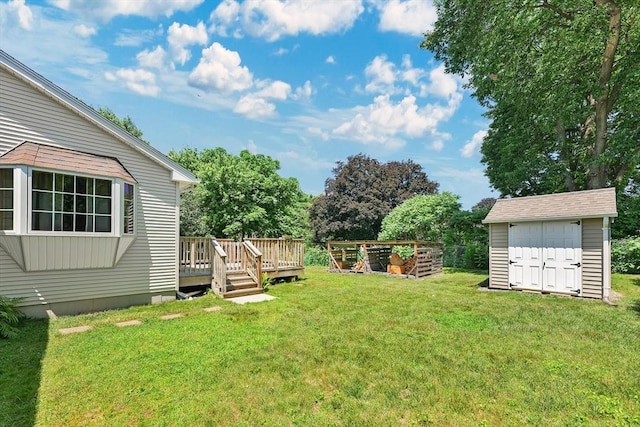 16 Amherst St, Chicopee, MA 01013 - view of green lawn featuring a shed and a deck