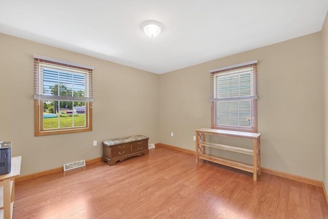 16 Amherst St, Chicopee, MA 01013 - empty room with light wood finished floors and baseboards