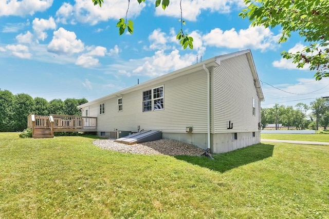 16 Amherst St, Chicopee, MA 01013 - rear view of property featuring a deck and a lawn