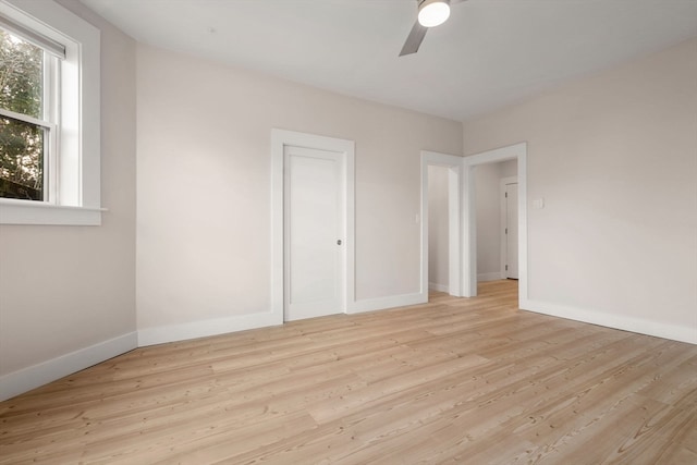 unfurnished bedroom featuring light wood-type flooring and ceiling fan