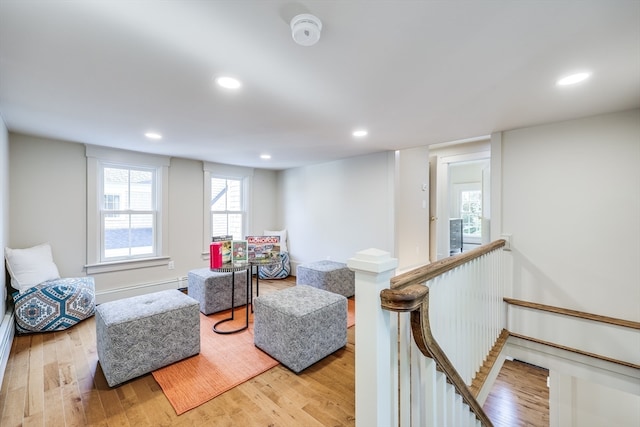 living room with a baseboard radiator and light hardwood / wood-style floors